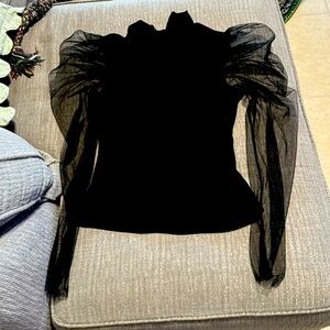 Black blouse with sheer puff sleeves in a size medium